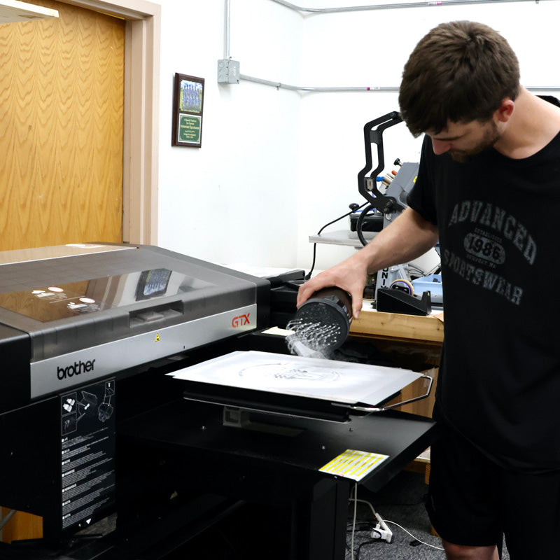 Advanced Sportswear employee creating a tshirt using DTG printing