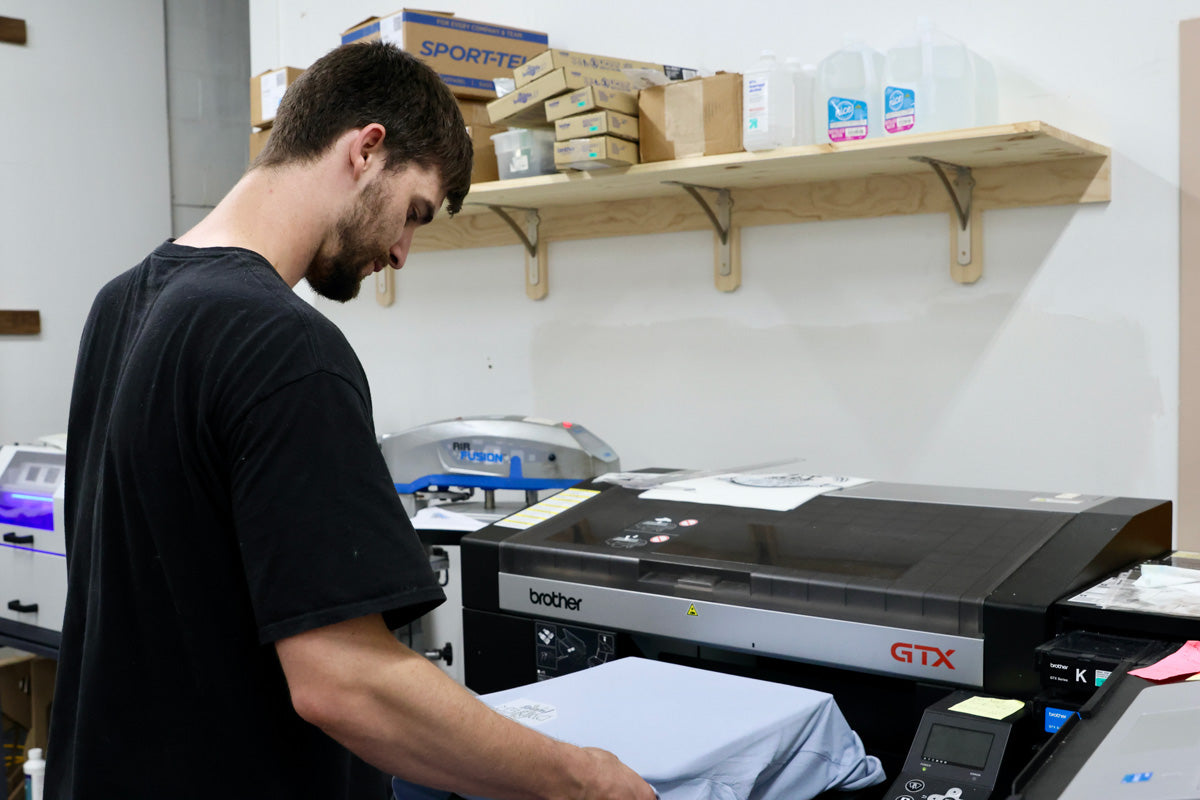 Advanced Sportswear employee making a customer's DTG project